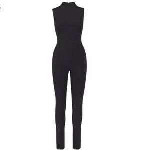 ALL-IN-ONE MOCK NECK SLEEVELESS ONESIE | ONYX